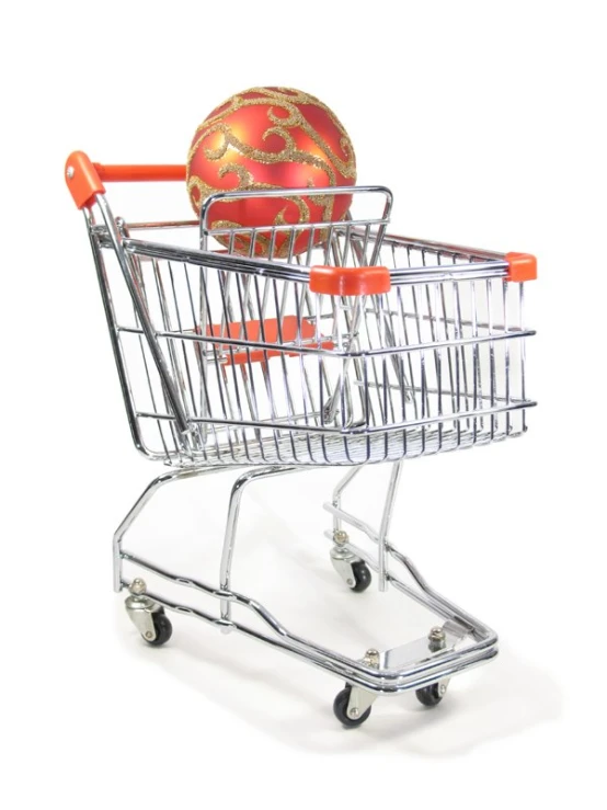 a shopping cart with an orange and gold ball