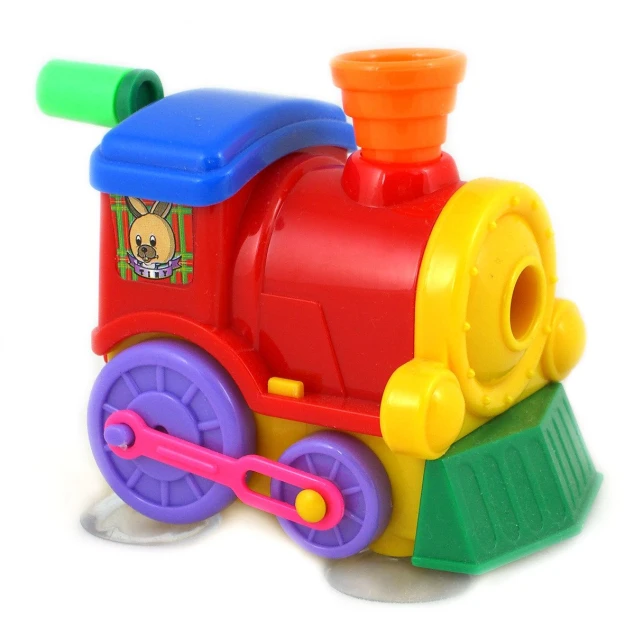 a small colorful plastic toy train with the wheels down