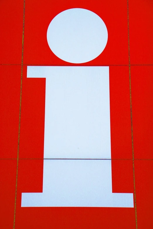 a large letter i is sitting on a red floor
