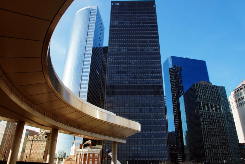 a view from the ground of the tall buildings in the city