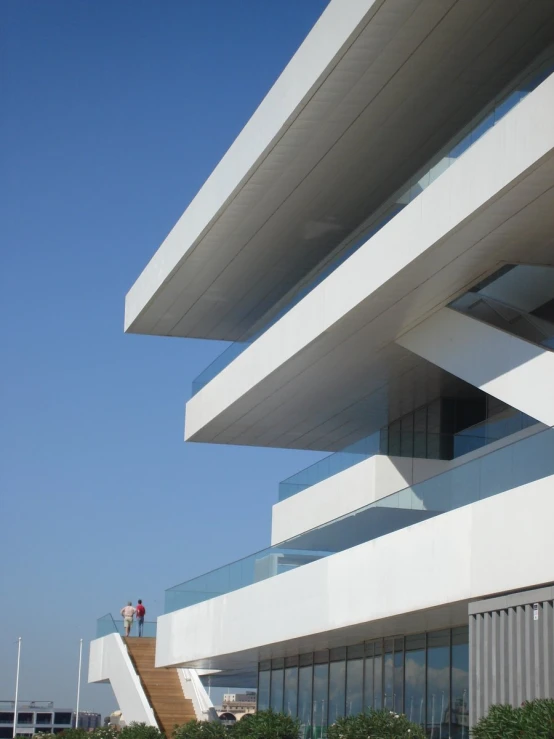 a man standing on a stair case of a building