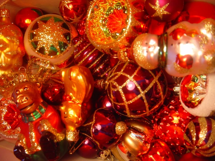 a box filled with christmas ornaments with a bear