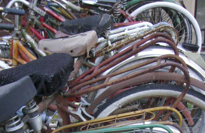 a large number of different bicycles lined up in a row