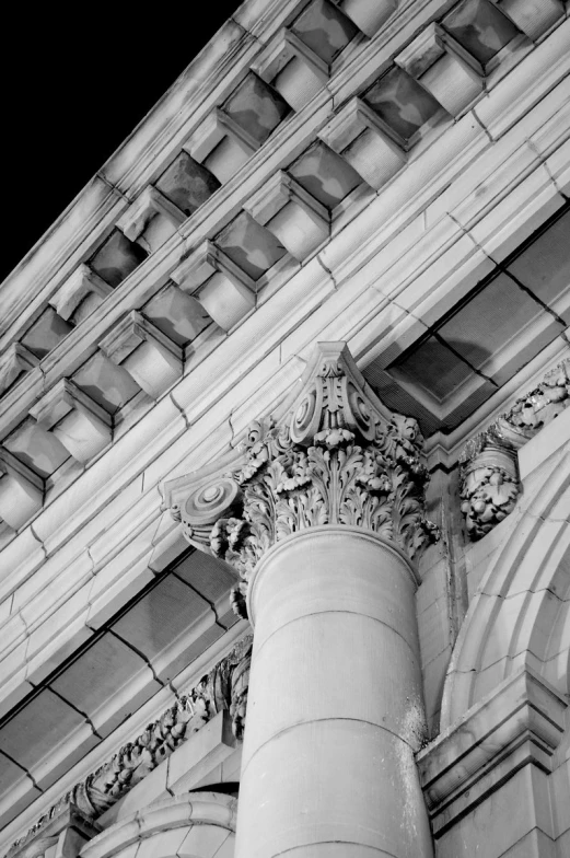 a very old building has a clock and a pillar