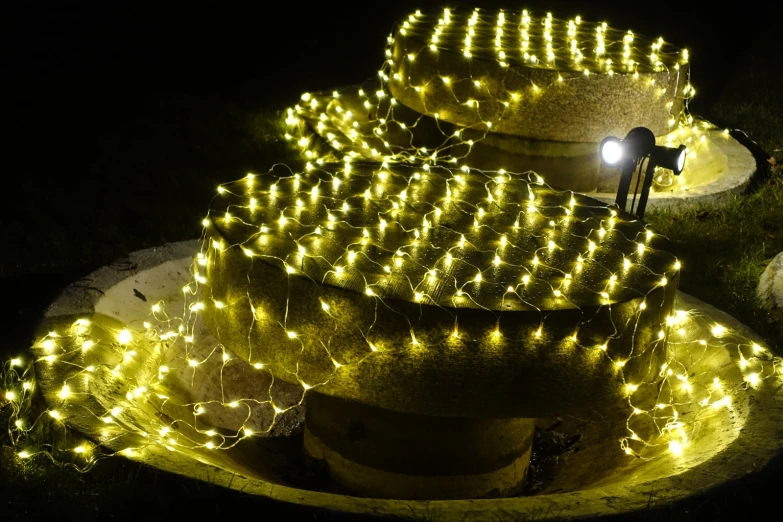 a very large cake with some lights on it