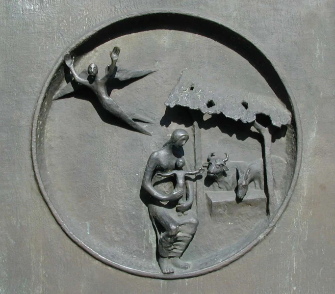 statue depicting a couple under an umbrella on concrete