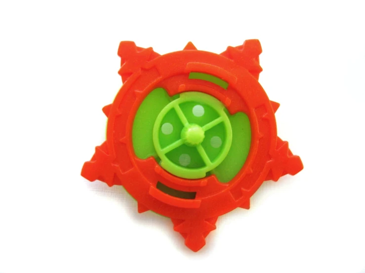 an orange toy with holes in the center of it