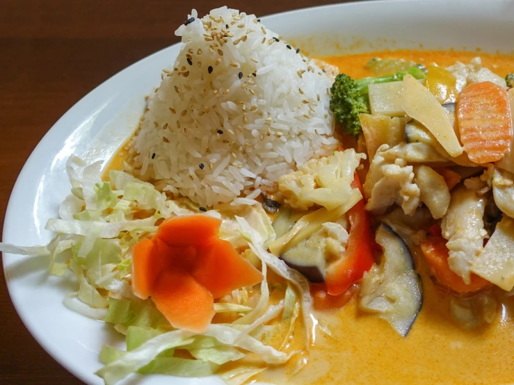 a large white bowl filled with lots of different foods