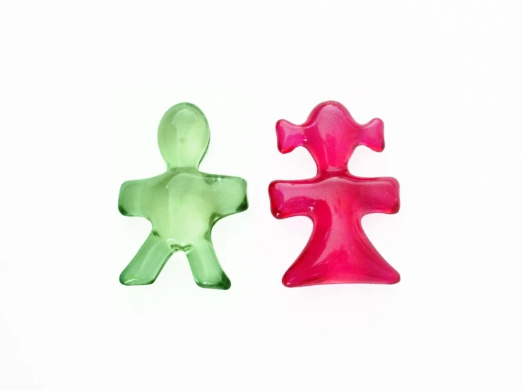 a pair of plastic figurines that look like a human