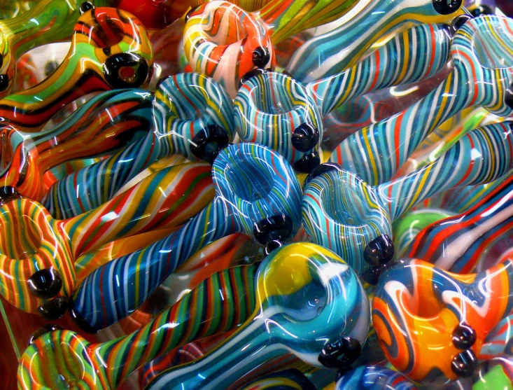 a colorful assortment of small and large blown glass beads