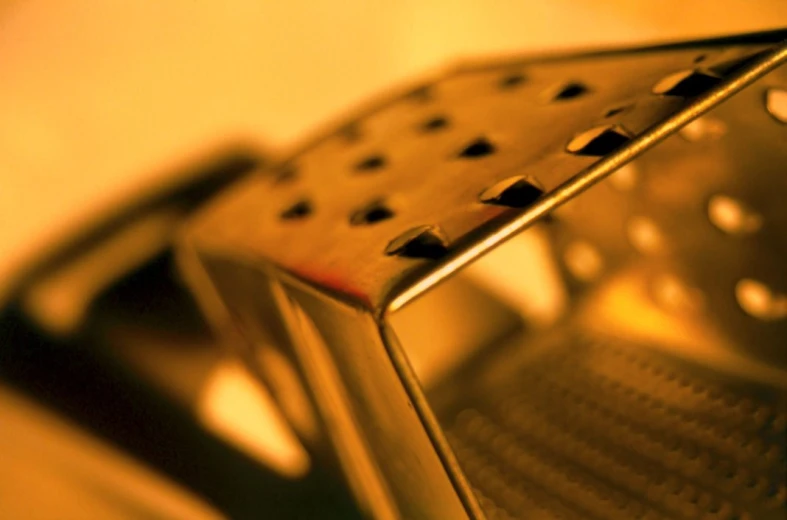 an image of a metal pan with holes on it