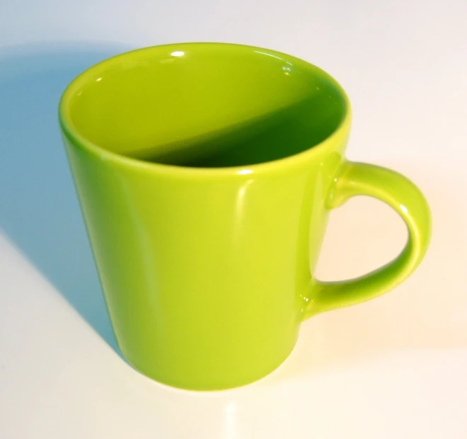 an empty cup has been placed in the shape of a mug