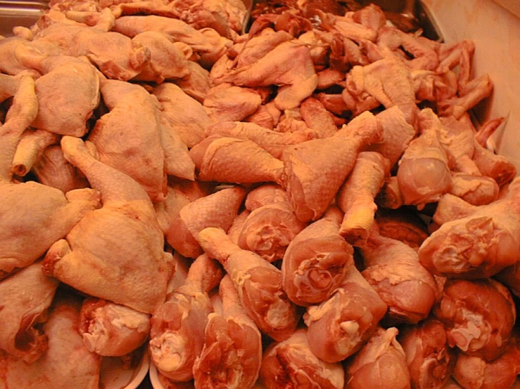 a pile of peeled meat sitting on top of a counter