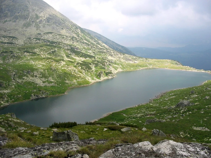 the view down the mountain shows the body of water