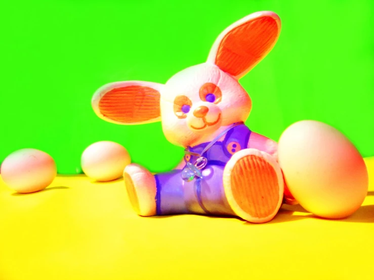 a stuffed rabbit doll sitting on top of a table