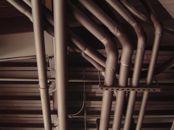 pipes hanging from a ceiling in a room