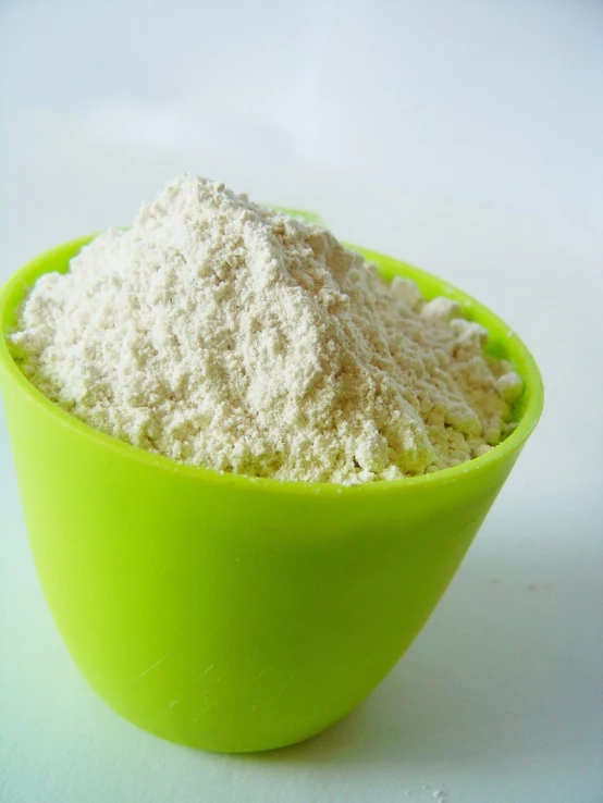 a bowl of white powder sitting on a table