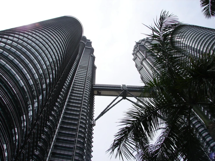 a large tall building with many trees in front of it