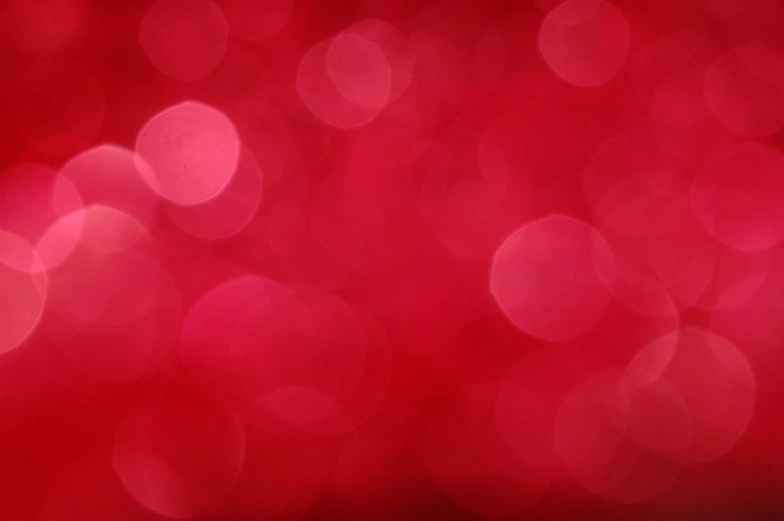 red and black circles are seen as a blurry background