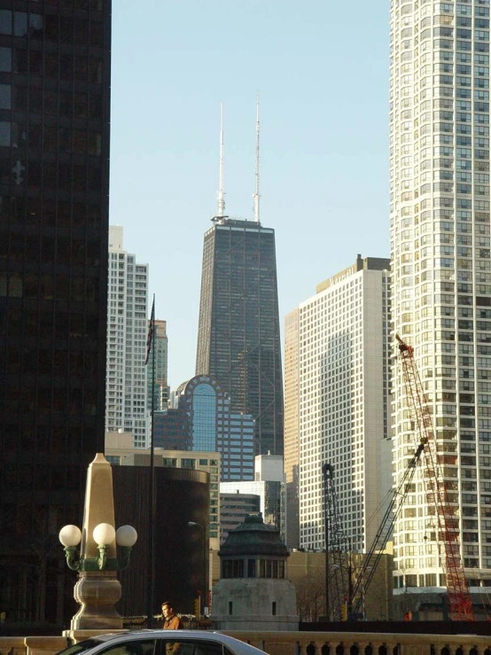 cars, buildings and light poles in a city