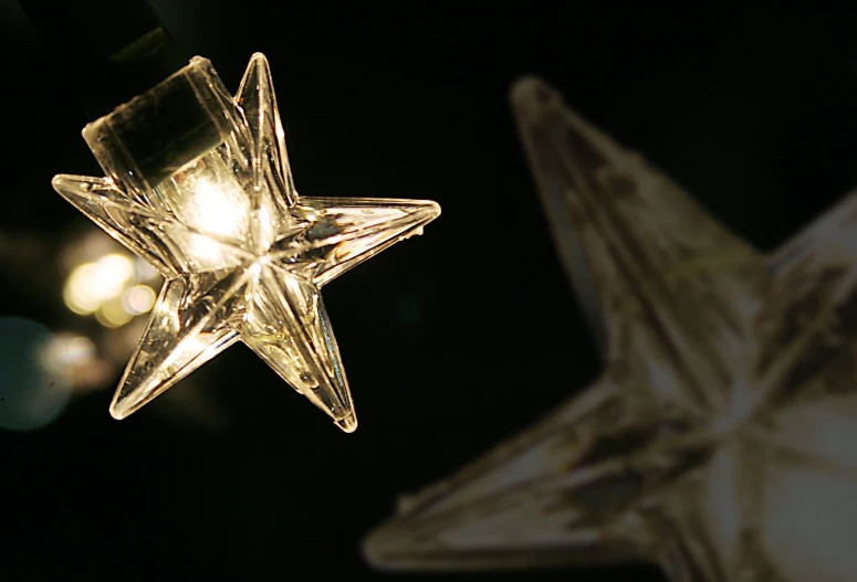 three stars are shown glowing at night