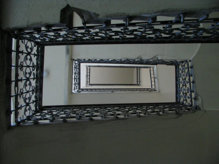 a small mirror that is hanging on a wall