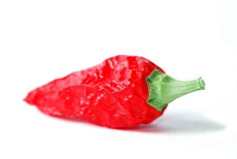 a plastic pepper that is very red and green