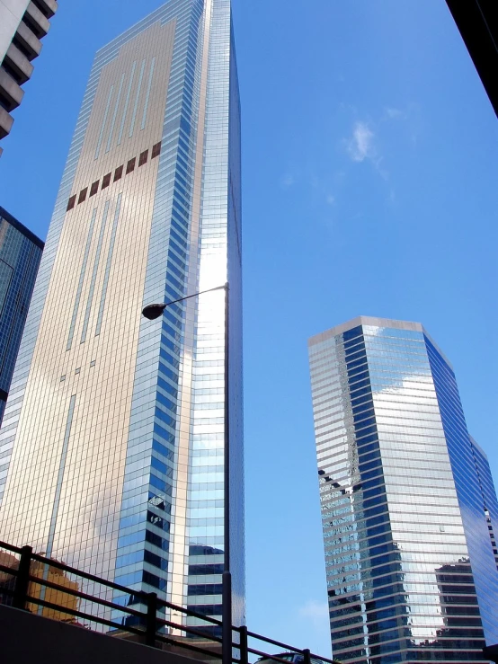 a couple of tall buildings that have sky in the background