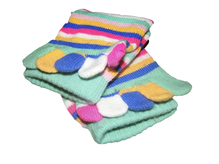 three pairs of colorful socks are stacked on top of each other