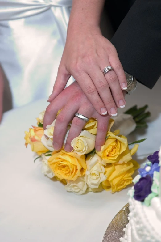 a bride and groom exchanging their wedding rings