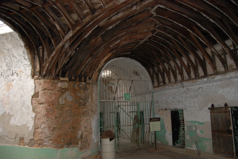 an old building with a wooden arched doorway