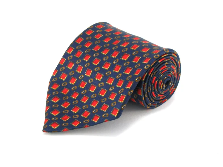 a blue tie with red squares and crosses on it