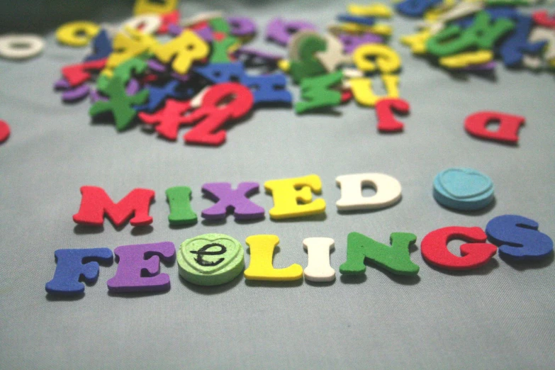 various colorful letters spelling out mixed feelings