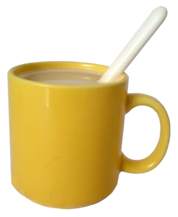an image of a mug that has a spoon in it