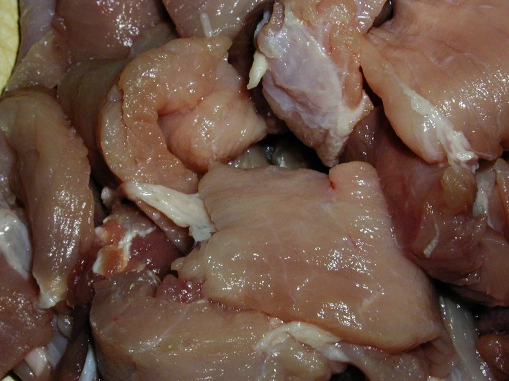 the close up picture of chicken pieces that are cooked