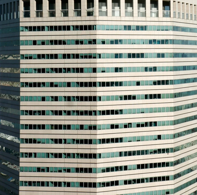a high rise office building is shown with many windows