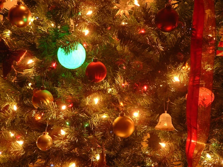 an up close view of a brightly colored christmas tree with lights