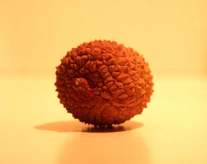 an orange object is on the table with light coming through