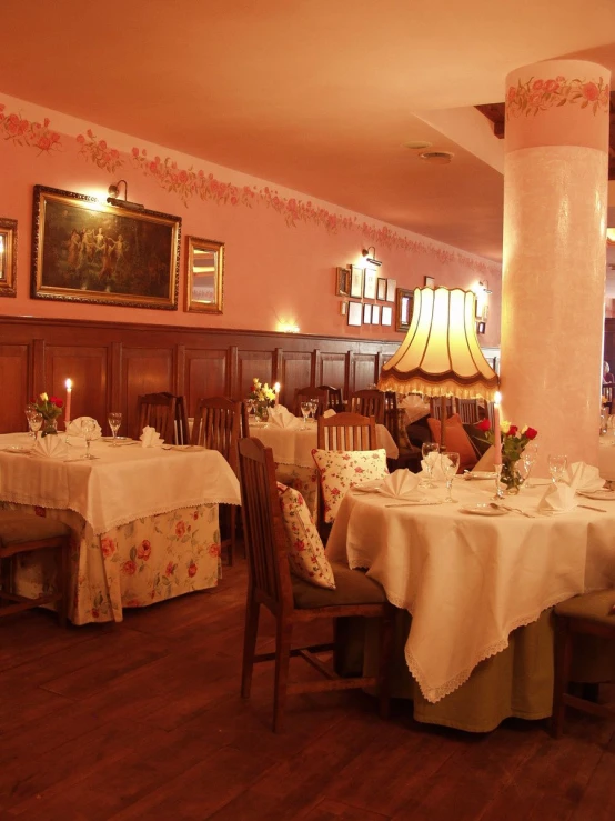 the dining area has been dressed in soft colors