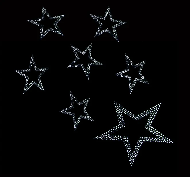 a black background with four different silver stars in rows