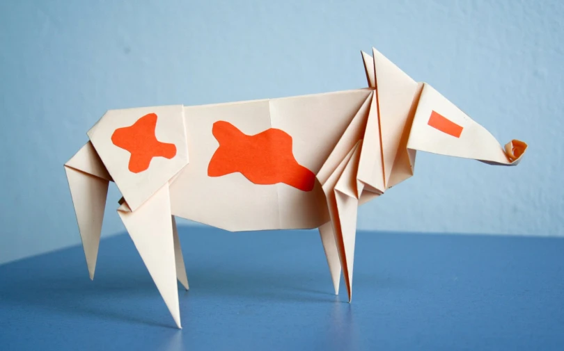 the paper cow is made into an origami