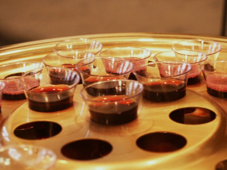 a tray that has a bunch of glasses on it