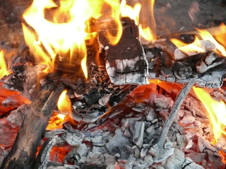 a  coal grill being used to cook food