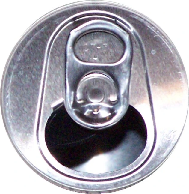 the top of a soda can with a hole in the middle