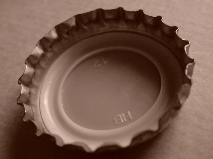 a black and white po of a plastic bottle cap