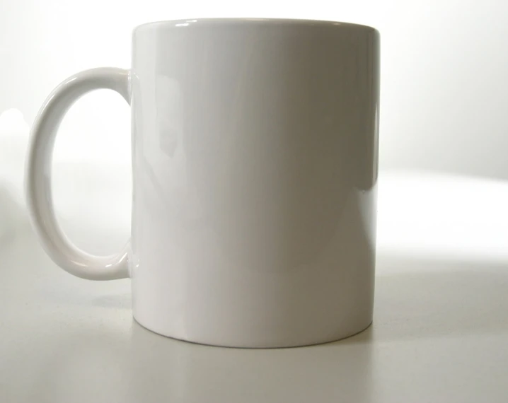 the white ceramic mug is on the table