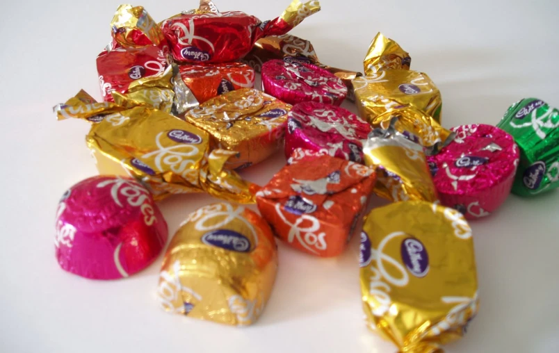 chocolate candies sitting in front of each other on a white surface