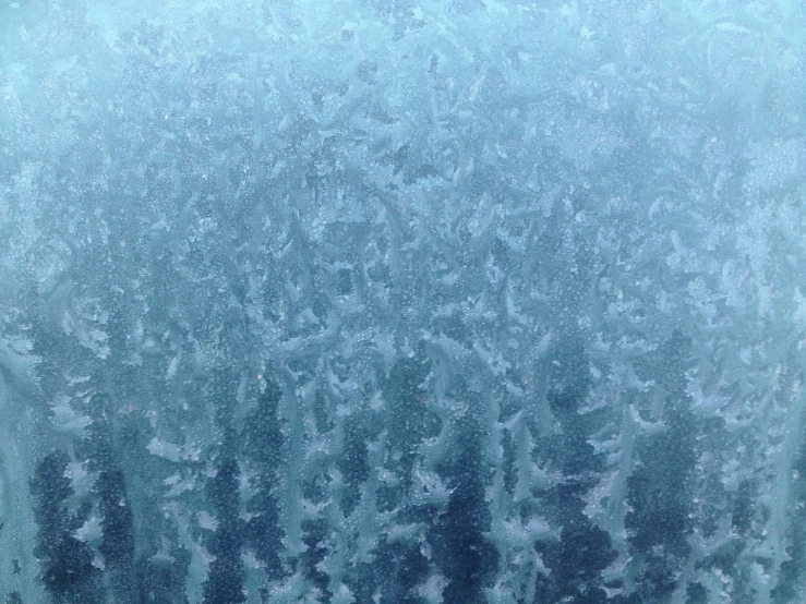 the background image of a window with frost