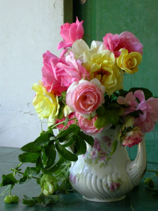 a vase with flowers in it sitting on a table