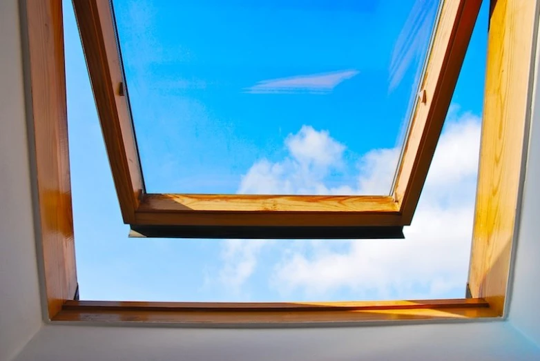 looking up through a wooden window into the sky